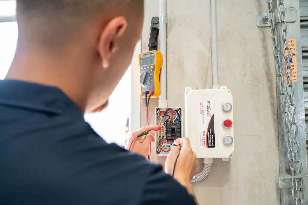 Licensed electrician testing a safety switch at a Sydney property