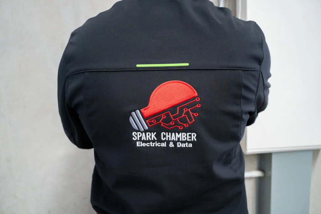 Spark Chamber electrician in branded workwear